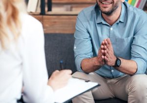 man talking to therapist about alcohol addiction treatment