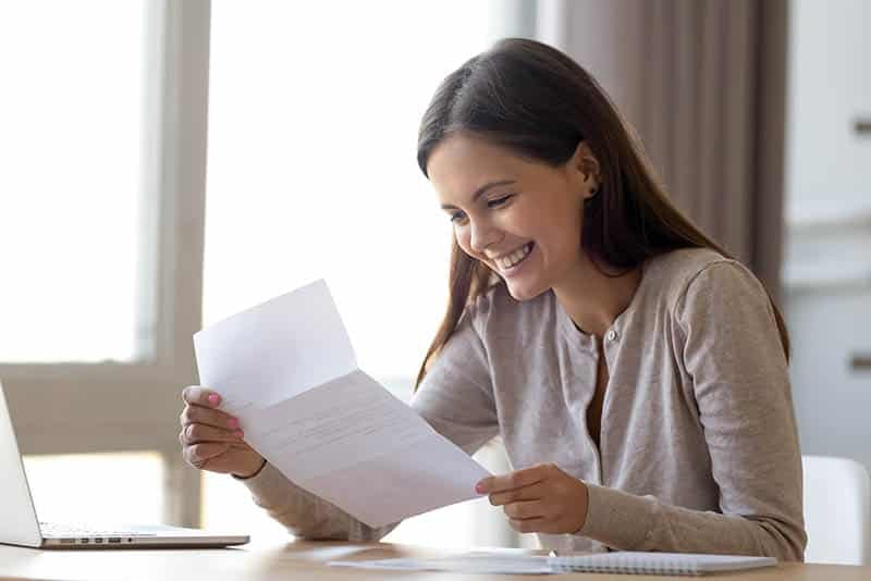 woman reading letter