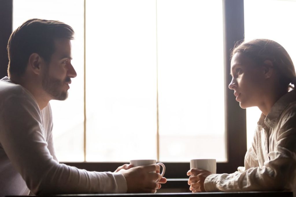 man and woman in office discussing the 5 signs your loved one is addicted to meth