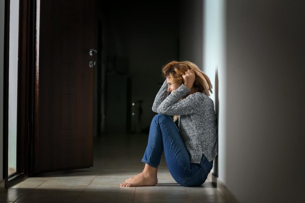 a woman has a breakdown in a doorway due to cocaine withdrawal