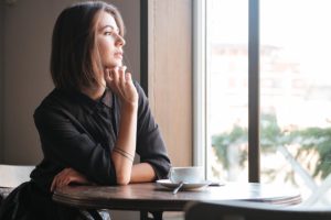 a woman tries to avoid common anxiety triggers to improve her mental health