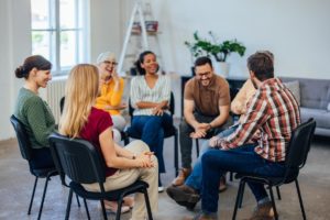 Folks in group therapy in an inpatient rehab