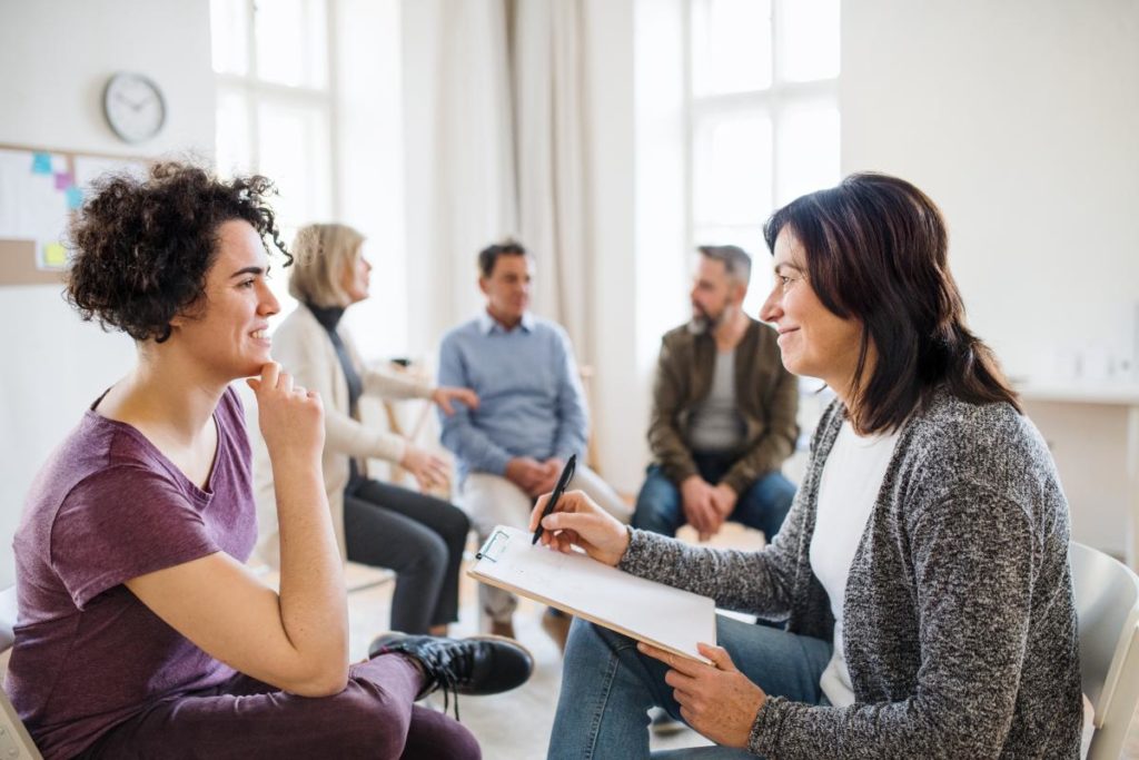 Patients in group therapy, learning difference between individual and group therapy
