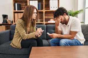 therapist explaining to worried young man the 5 myths about adderall