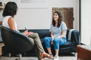 Two women discussing disorders treated with cognitive-behavioral therapy