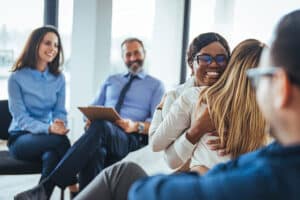 middle-aged male therapist leading a group session as part of a drug detox center program