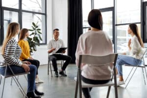 Group of People Discussing 5 Reasons to Consider a Drug Rehab