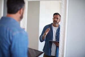 a person talks to a counselor in a bipolar disorder treatment program