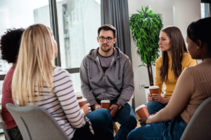 group of men and women discussing the best way to find a drug detox center in Omaha, NE