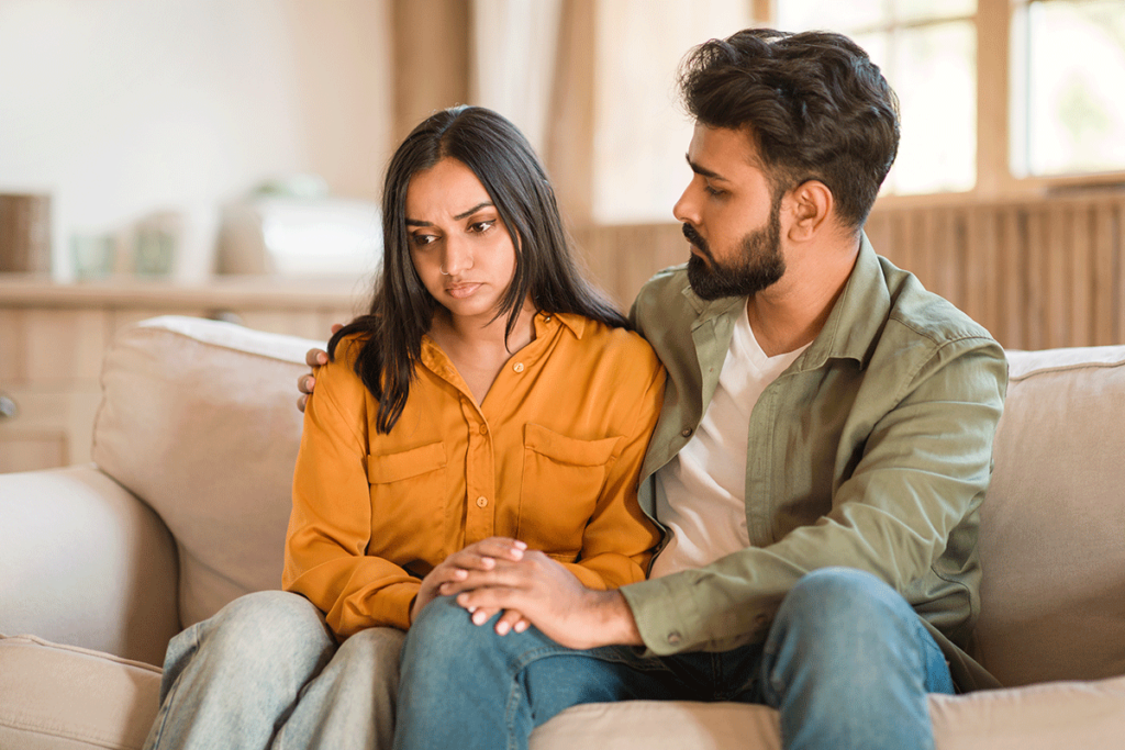 A couple talking about how to spot symptoms of alcohol addiction in your partner